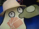 Beer ghost in a pink trillby playing cards drunk